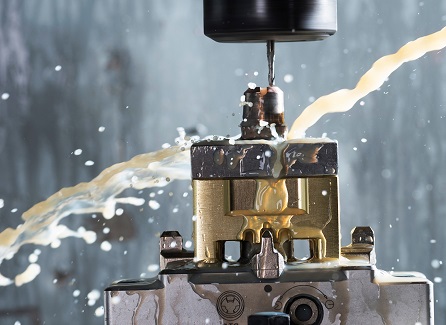 Closeup of a machine drilling a screw