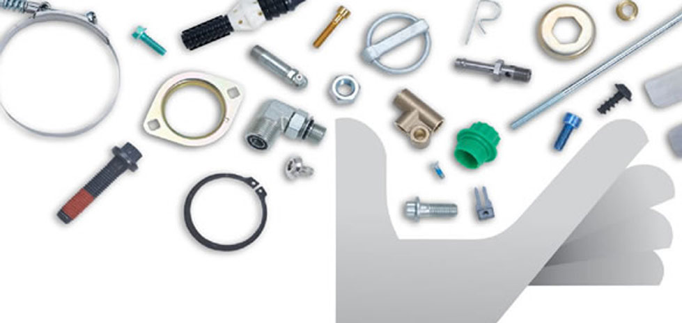 Assorted nuts, bolts, washers, screws and components with a grey hand below them