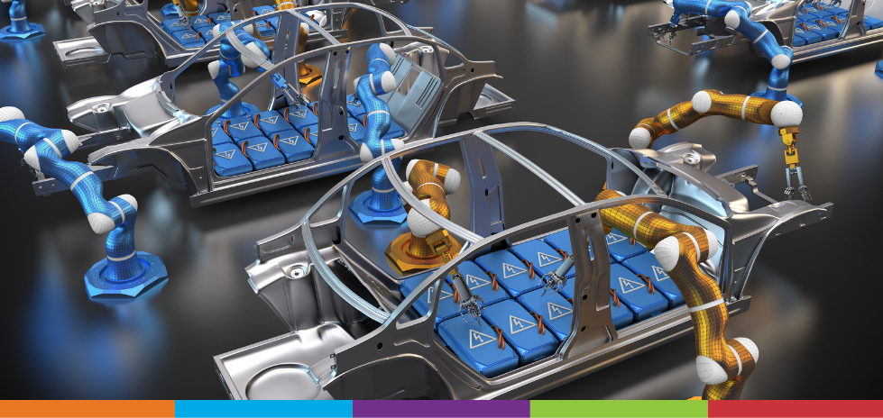 Una linea di produzione di veicoli elettrici con bracci robotici che assemblano le batterie al loro interno