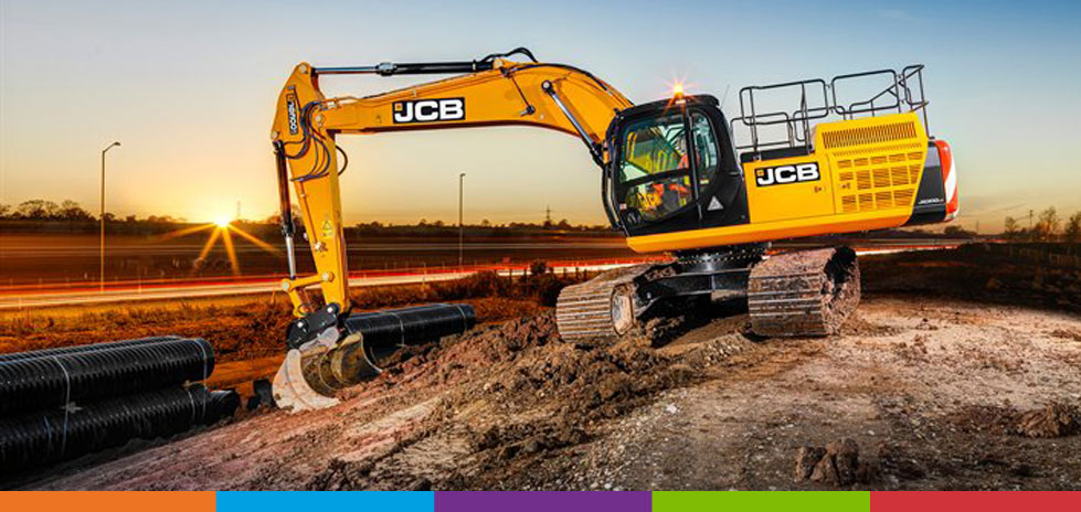 An electric excavator digging up dirt on a job site