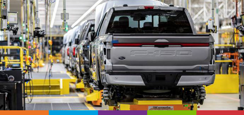 Assembly line with electric Ford F-150 pick-up trucks being manufactured