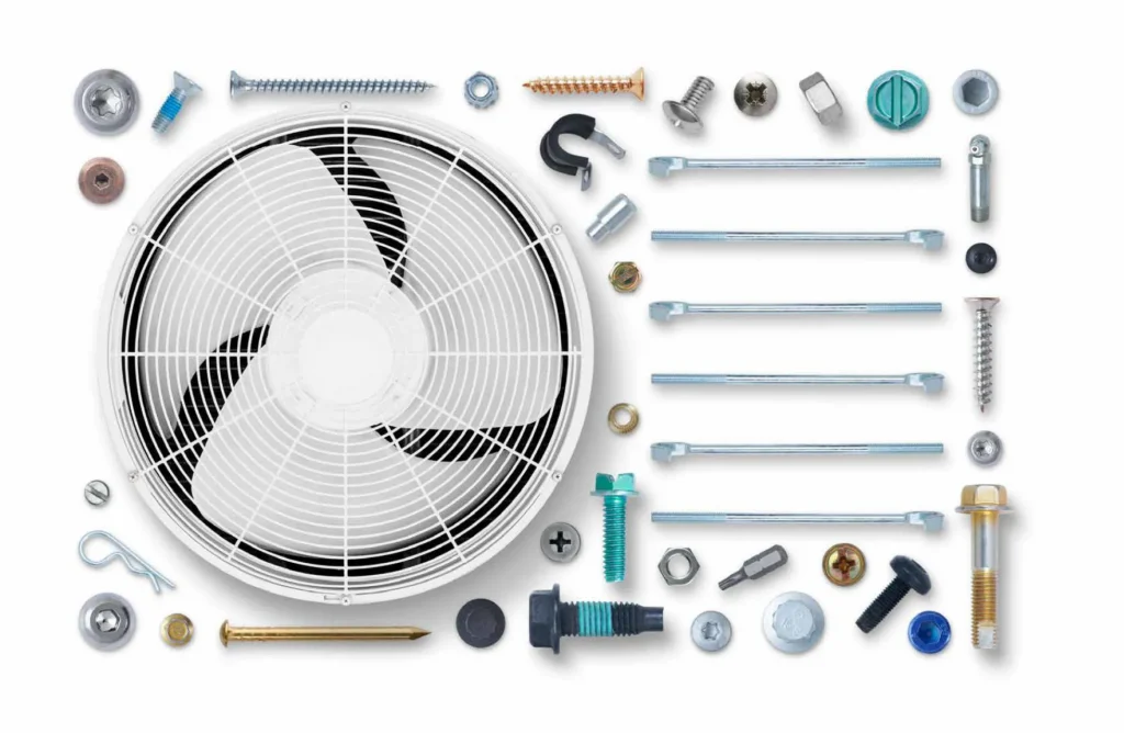 Air conditioner made with parts and tools over white bg